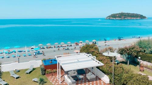 an aerial view of a beach with people and umbrellas at Villa Pietra Rossa in Diamante