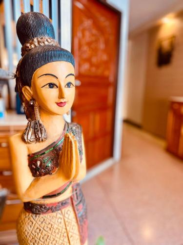 a figurine of a woman with at Phang Nga Guesthouse in Phangnga