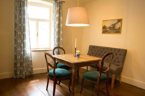 a dining room with a table and chairs and a window at Renaissancehof Wieser Wachau in Wösendorf