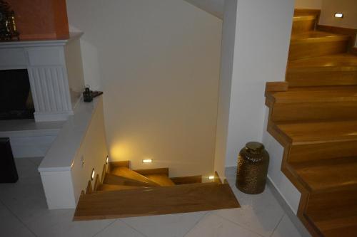 a staircase in a house with lights on it at Chara host in Olympia