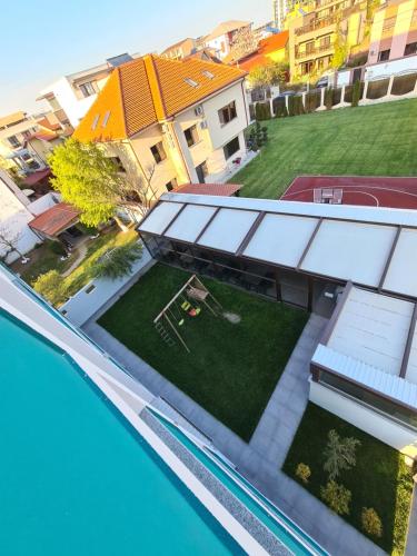 an aerial view of a house with a swimming pool at Turquoise Boutique in Mamaia Nord