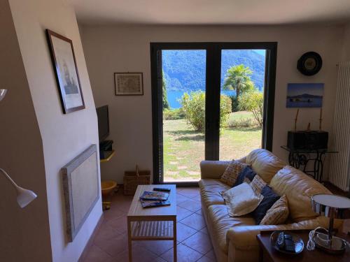 a living room with a couch and a table at St. Maurice smile in Ghiffa