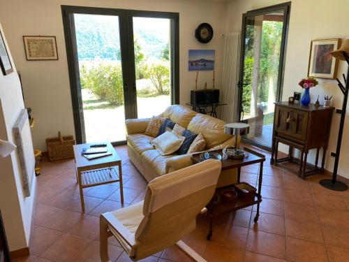 a living room with a couch and a table at St. Maurice smile in Ghiffa