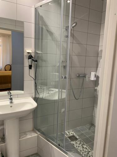a bathroom with a shower and a sink at NB Apartments Riga Old Town in Rīga