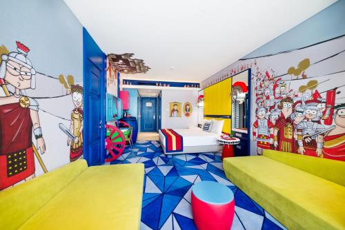 a childrens room with a cartoon themed wall at The Land Of Legends Kingdom Hotel - All-in Concept in Belek