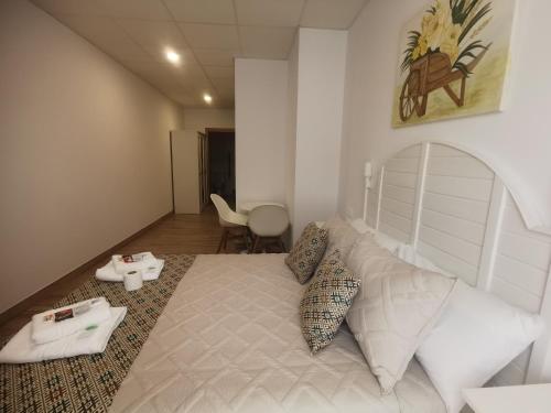 En eller flere senge i et værelse på Lar do Peregrino