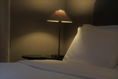 Postel nebo postele na pokoji v ubytování Santellone Lifestyle Resort