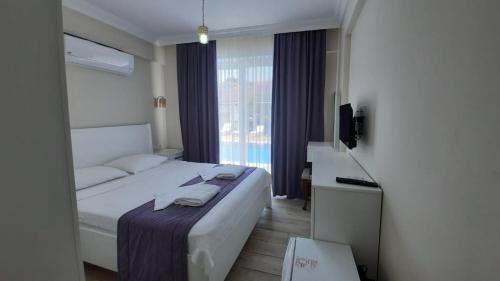 Кровать или кровати в номере Vespera hotel