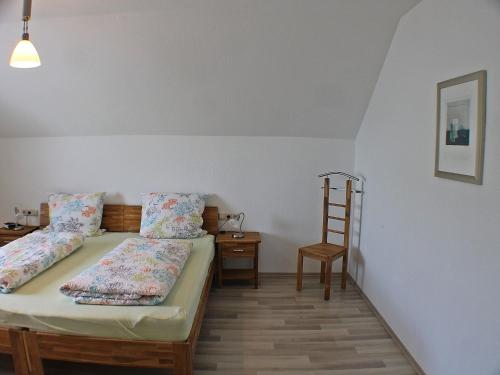 Cama ou camas em um quarto em Ferienwohnung Arnold Laubbach