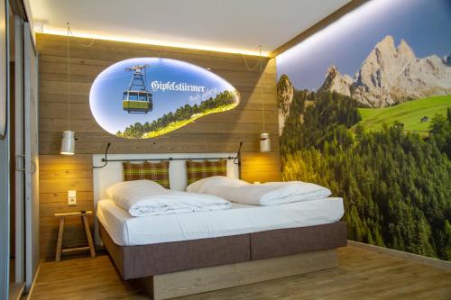 a bedroom with a bed with a sign on the wall at Cocoon Hauptbahnhof in Munich