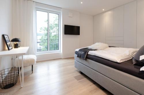 Ένα ή περισσότερα κρεβάτια σε δωμάτιο στο LOFT17 Neu Luxus-Loft Design Klima 2-4 Personen