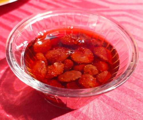 a glass bowl filled with meatballs on a table at Къща за гости Романс in Yagodina