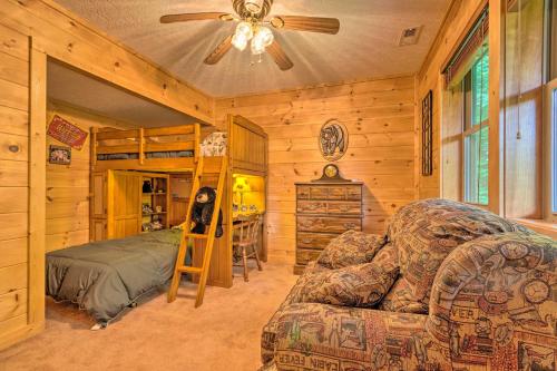 a bedroom with a bed and a couch in a room at Mountain-View Maggie Valley Home with 2 Decks! in Waynesville