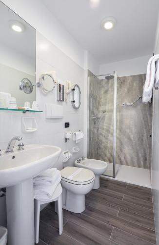 a bathroom with a sink and a toilet and a shower at Best Western Regina Elena in Santa Margherita Ligure