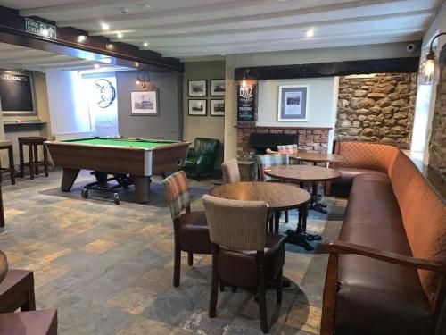 a bar with a pool table and ping pong ball at The Farmers Arms Inns in Catterick Bridge