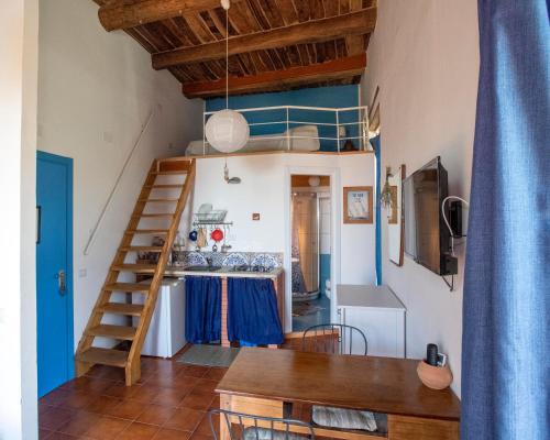 TV a/nebo společenská místnost v ubytování La Casa sul Blu Albergo Diffuso