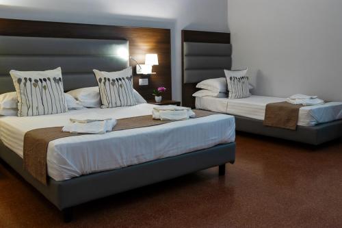 Cama o camas de una habitación en Re Vittorio De Luxe