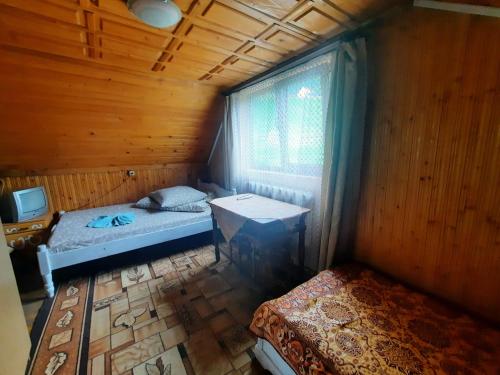 Säng eller sängar i ett rum på Dzherelo