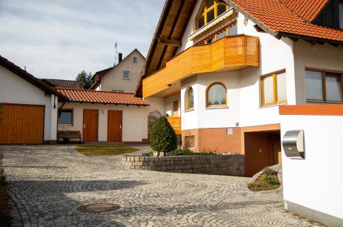 a house with a stone driveway in front of it at Appartement Ludwigskanal in Schwarzenbruck