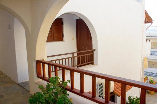 an external view of a house with a balcony at Bay View Apts II in Sitia