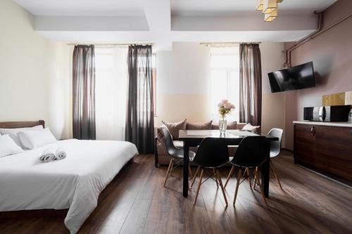 Ένα ή περισσότερα κρεβάτια σε δωμάτιο στο Aparthotel Na Mytniy