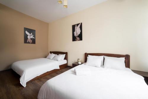 Ένα ή περισσότερα κρεβάτια σε δωμάτιο στο Aparthotel Na Mytniy
