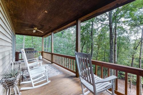 two rocking chairs on a porch with trees at A Heavenly View in Blue Ridge