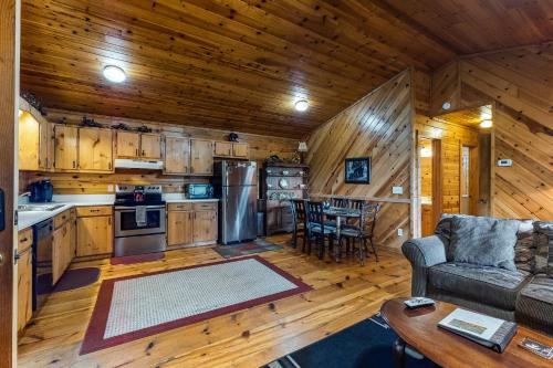 a kitchen and living room of a cabin at A Heavenly View in Blue Ridge