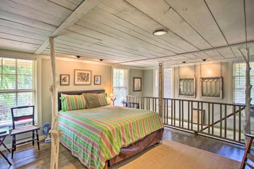 a bedroom with a bed and a balcony at The Quarters at Fairmount Cottage with Shared Pool in Fort Worth