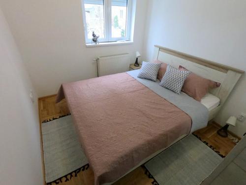 Postel nebo postele na pokoji v ubytování Apartman OAZA