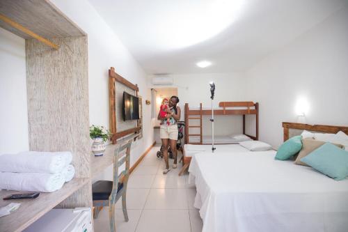 Ένα ή περισσότερα κρεβάτια σε δωμάτιο στο Hotel Chácara das Flores