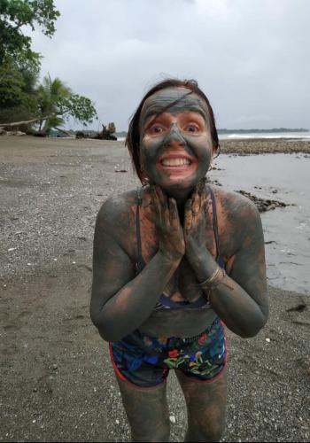 a man with a face paint on the beach at Four Monkeys Eco Lodge - Jungle & Beach in Cabo Matapalo