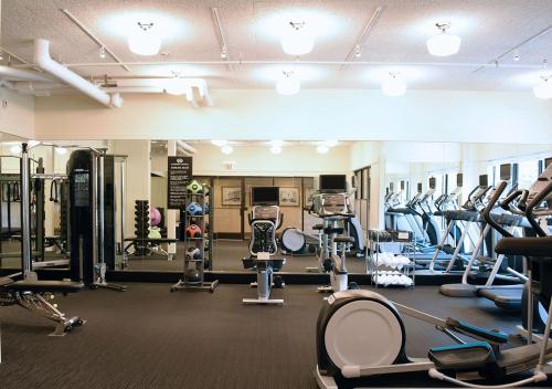 a gym with lots of treadmills and machines at O.Henry Hotel in Greensboro