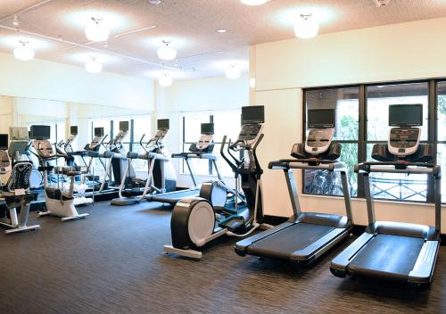 a gym with a bunch of treadmills and machines at O.Henry Hotel in Greensboro