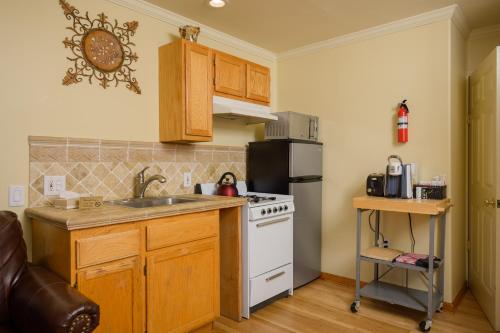 a kitchen with a white stove and a sink at Marina Motel in San Francisco