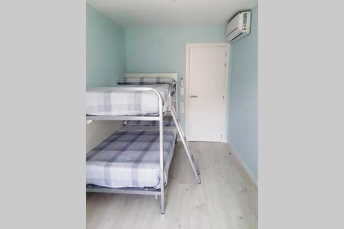 a small room with two bunk beds in it at Barcia 2 in Pontevedra