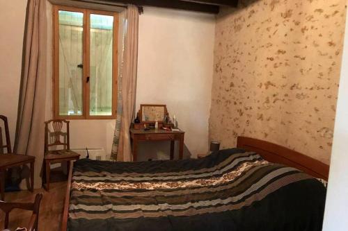 Posteľ alebo postele v izbe v ubytovaní Maison La Brenne