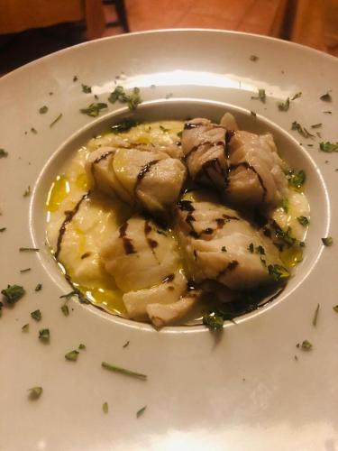 a plate of food with meat on a plate at b&b Da Morena in Termoli