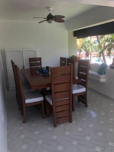 a dining room with a table and chairs at La Gaviota A3 in Juan Dolio