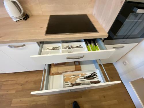 a small kitchen with a stove in the middle at HARMONIA II Apartment in Františkovy Lázně