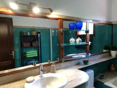 a bathroom with a sink and a mirror at Villa Altamosa in Yaiza