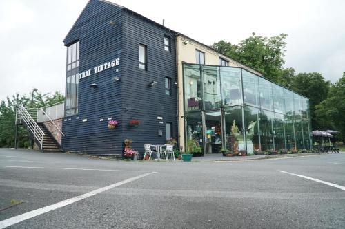 a building on the side of a street at The Old Mill Whitchurch in Whitchurch