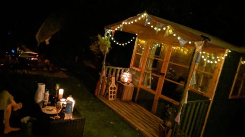 an image of a house with lights on it at night at Glamping with Llamas in Wisbech