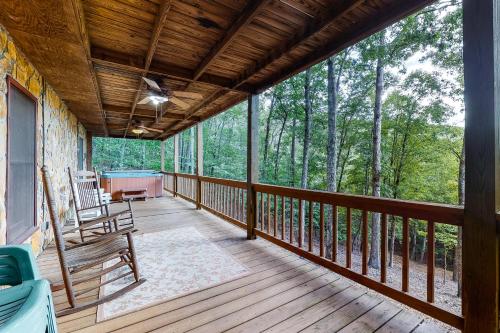 a screened in porch with a bench on a deck at A Heavenly View in Blue Ridge