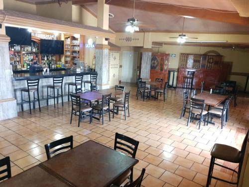 Ресторант или друго място за хранене в Hotel Posada Santa Fe