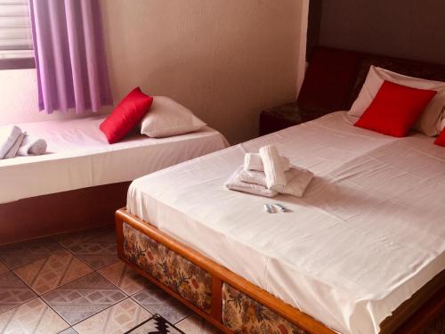 Ένα ή περισσότερα κρεβάτια σε δωμάτιο στο Hotel Cambará