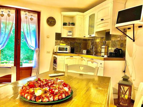 a pizza sitting on top of a counter in a kitchen at Il Bosco Guest House Subiaco in Subiaco