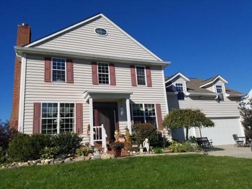 a white house with red shutters at Indys Hidden Gem in Indianapolis