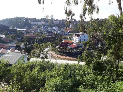 a view of a town from a hill with houses at Caly homestay in Da Lat