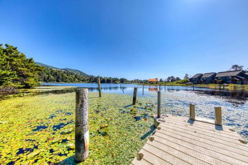 a wooden dock in a body of water at Lake & Ocean in Rockaway Beach